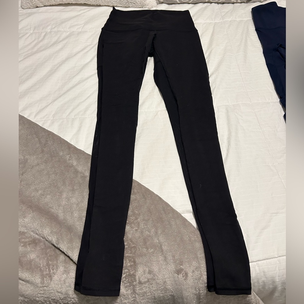 Black lululemon leggings with shed on the back